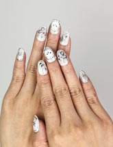 Hand wearing Naillover Silver Starry Cutie handmade press on nails with galaxy-inspired design, bunny, and star accents.